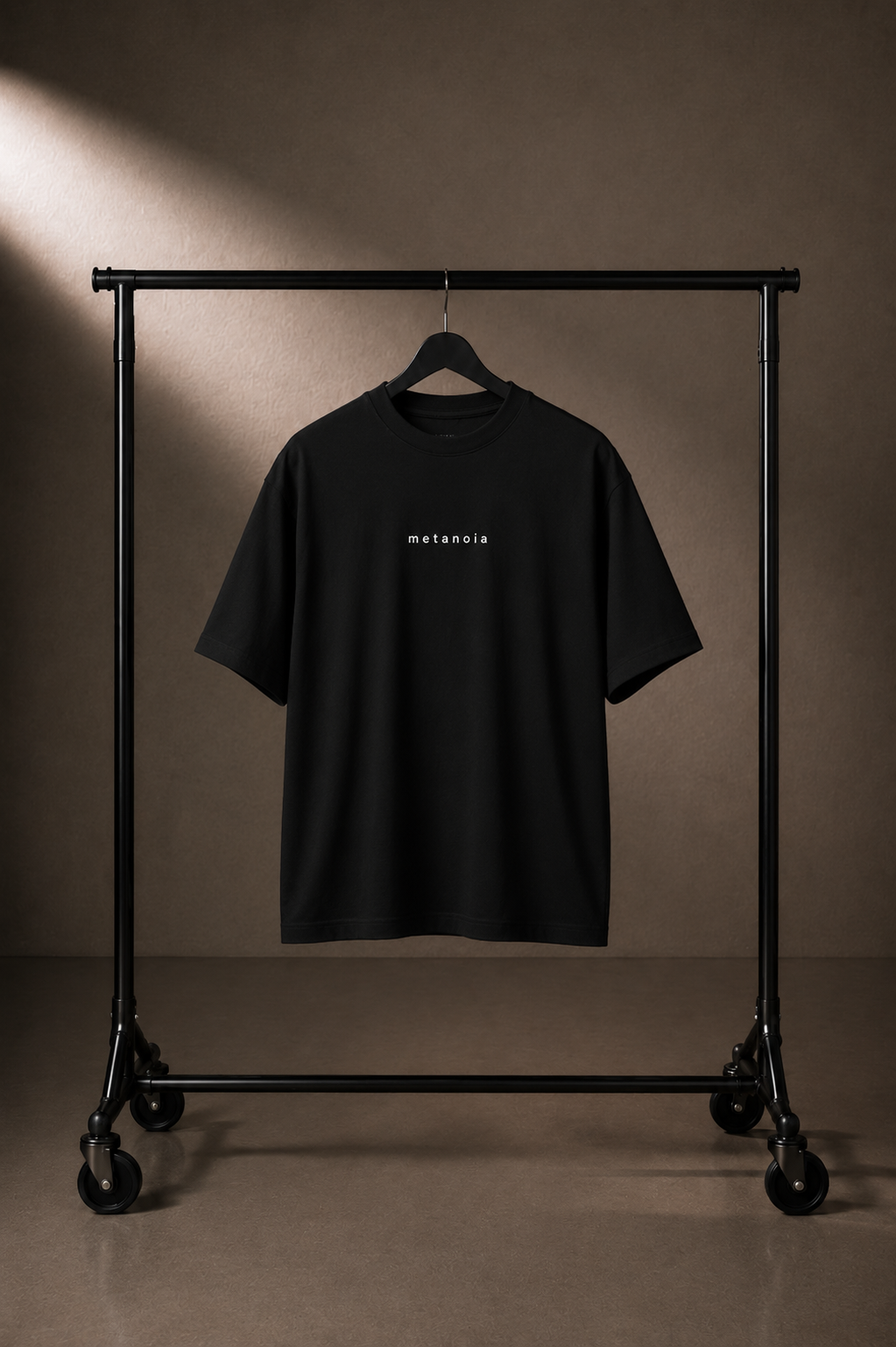 METANOIA High-Neck Tee in Black on hanger