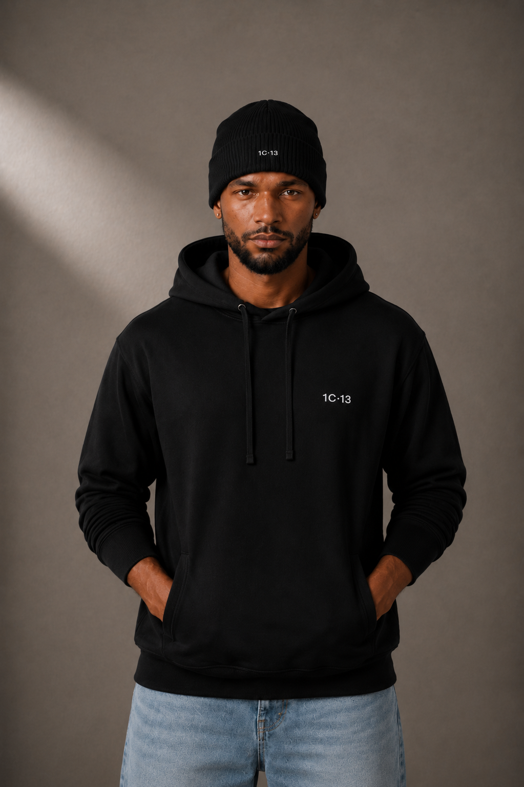 1C·13 Ribbed Beanie in Black, front view on male model
