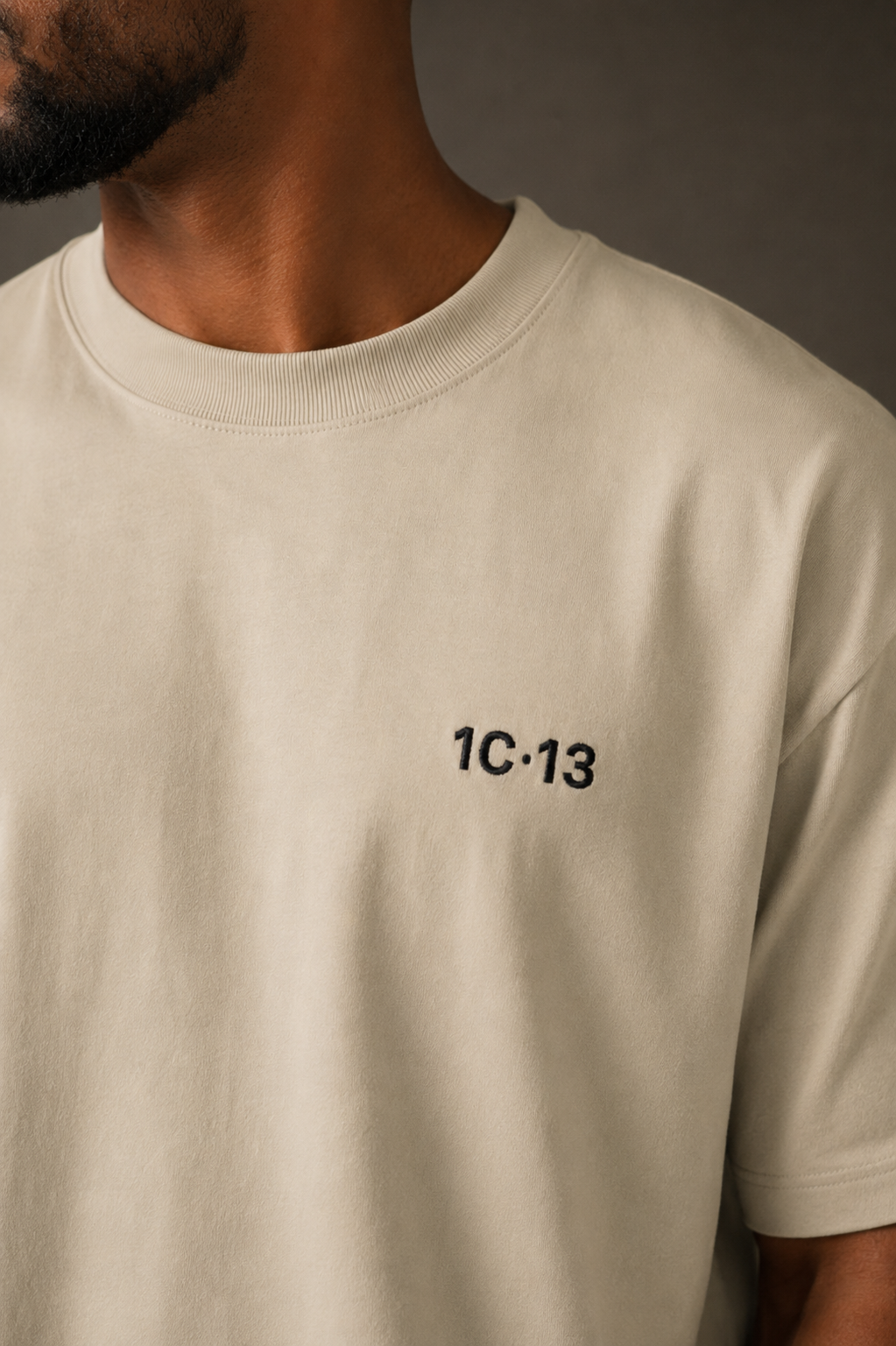 1C·13 High-Neck Tee in Beige, front close-up on male model