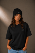 1C·13 Ribbed Beanie in Black worn by female model