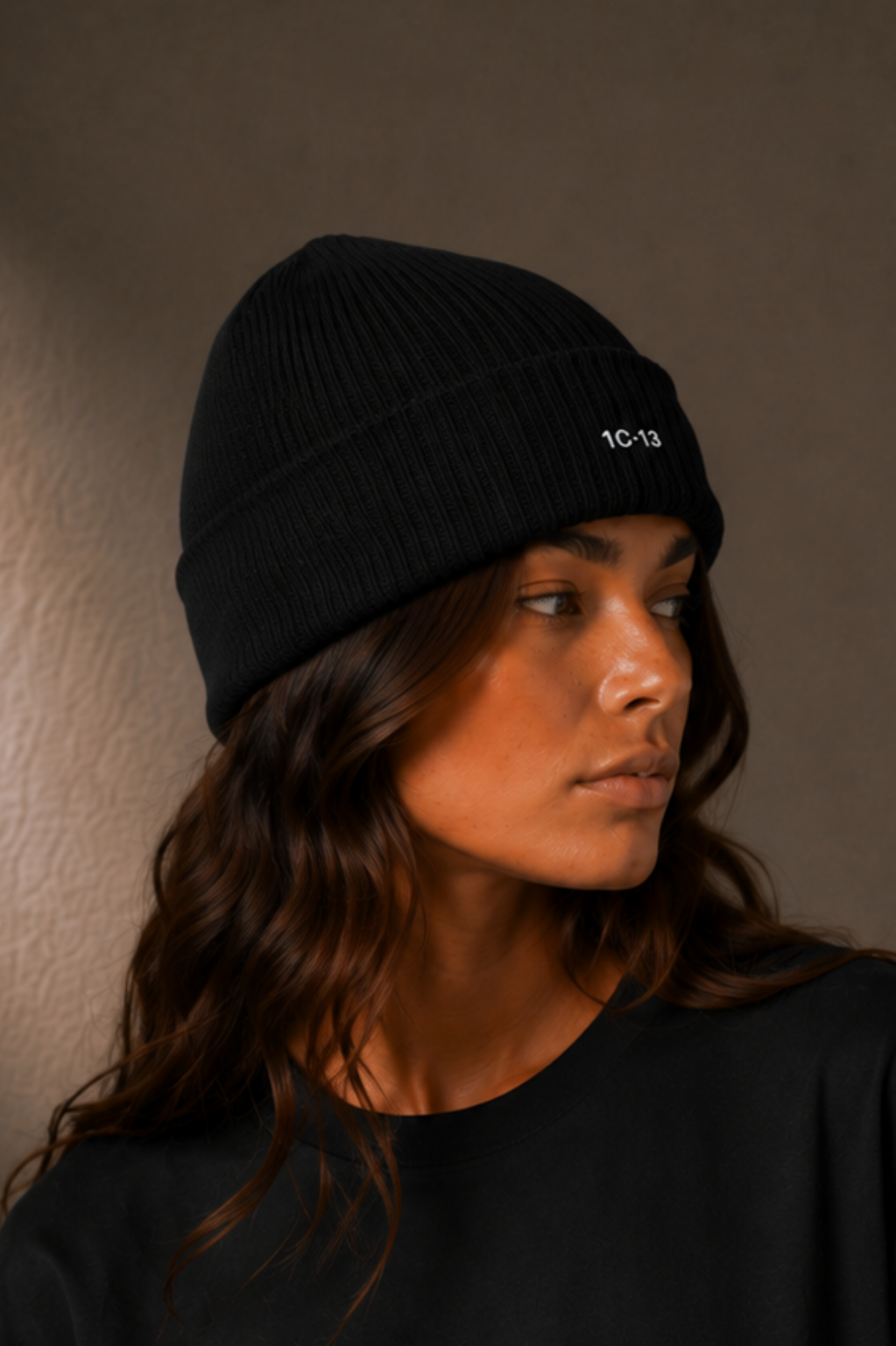 1C·13 Ribbed Beanie in Black, side view on female model