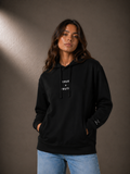 TRUTH Side-Pocket Hoodie in Black, front view on female model